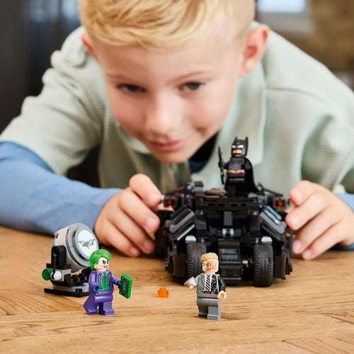 Child playing with lego 76303 dc batman building set 
